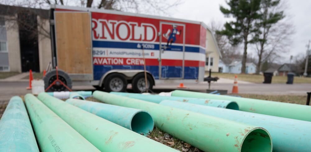 Arnold & Sons Technician performing a sewer replacement