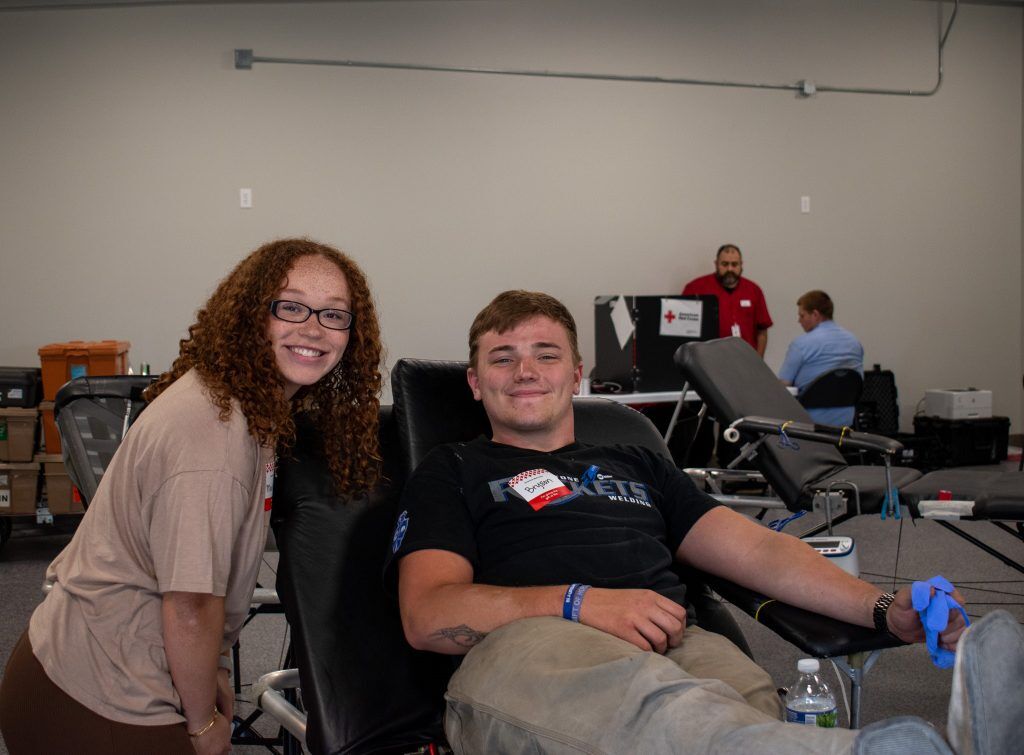 Arnold & Sons team giving blood