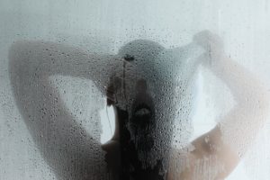 woman in shower - Plumbing, sewer, & drain services in Peoria IL