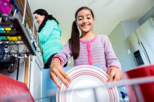Family doing dishes - Plumbing, sewer, & drain services in Peoria IL