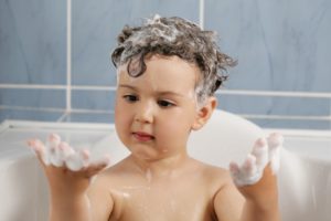 Kid playing with bubbles - Plumbing, sewer, & drain services in Peoria IL