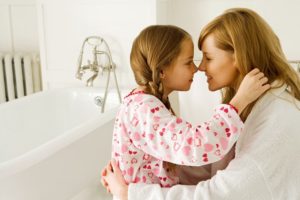 mother and daughter hugging - Plumbing, sewer, & drain services in Peoria IL