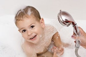 toddler taking a bath - Plumbing, sewer, & drain services in Peoria IL