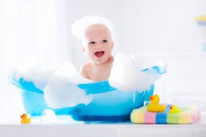 baby taking bath - Plumbing, sewer, & drain services in Peoria IL