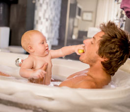 Baby in bathtub - Plumbing, sewer, & drain services in Peoria IL