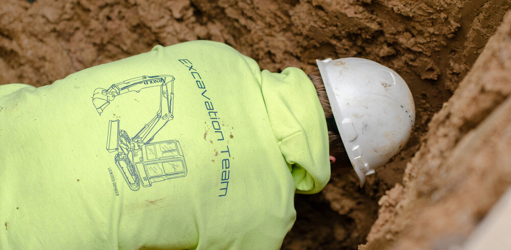 Arnold & Sons Technician performing a drain replacement